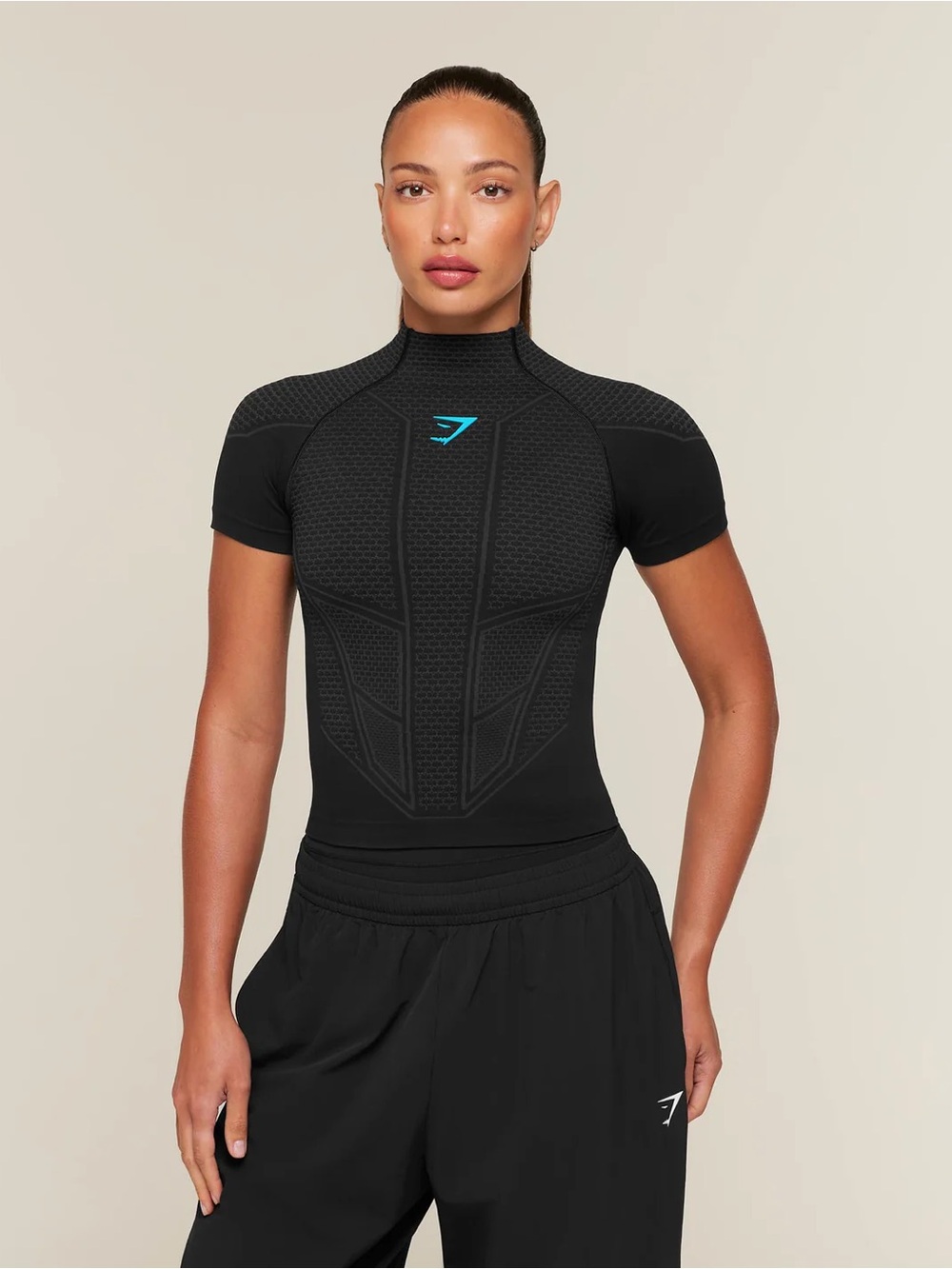 Gymshark ONYX V1 Baby tee Black Short-Sleeve Compression Bodysuit with Teal Logo